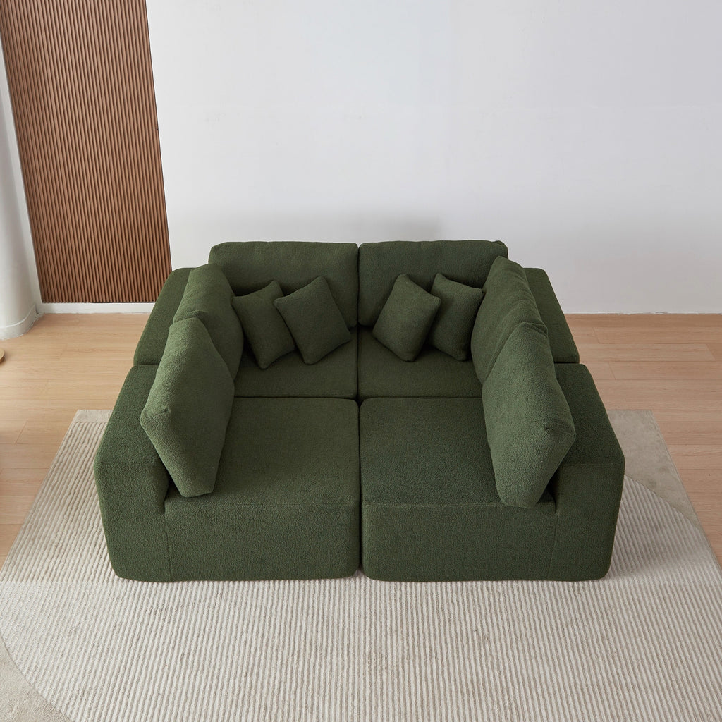 A forest green 5-seater modular sofa with a corner unit and two armrest ends, made with a low-profile and minimalistic design with cushions.