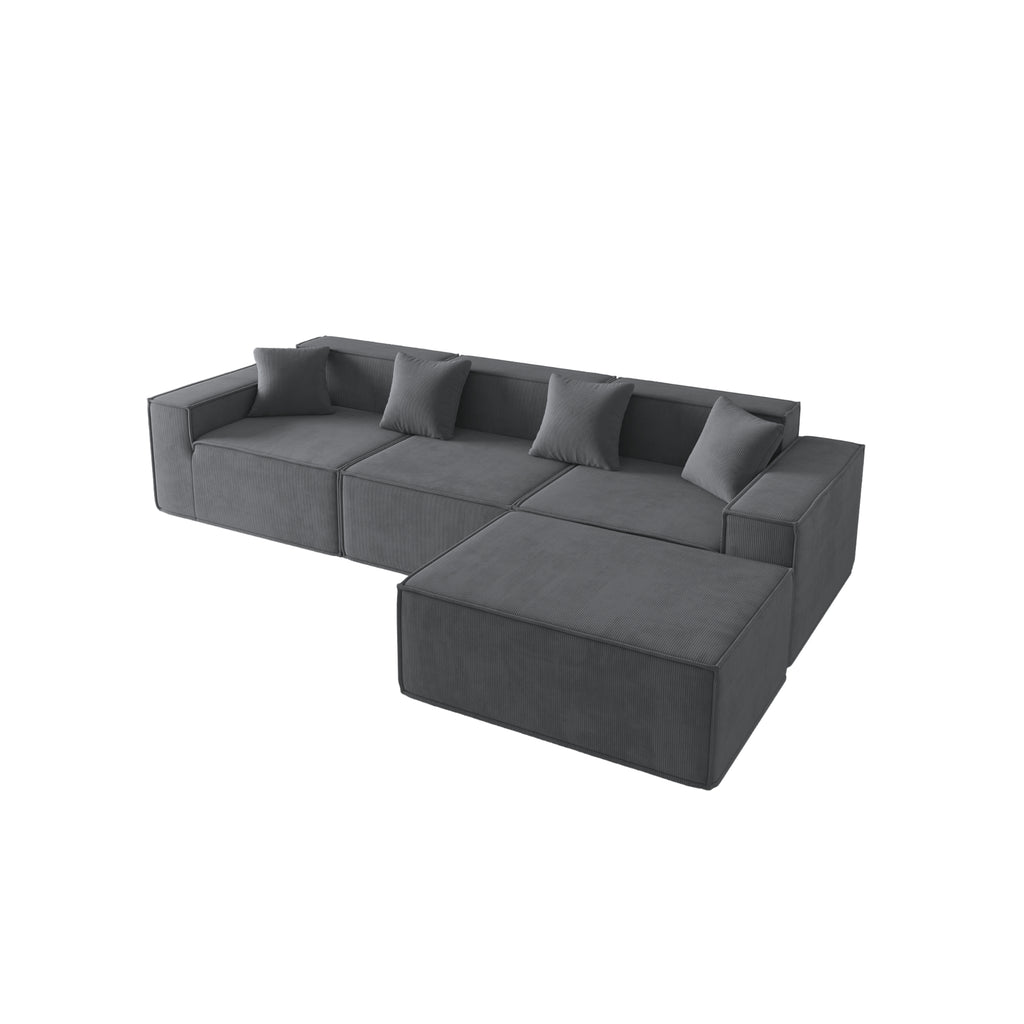A slate grey three-seater corduroy sofa with an ottoman, featuring a modern, low-profile design with plush cushions and a structured silhouette.