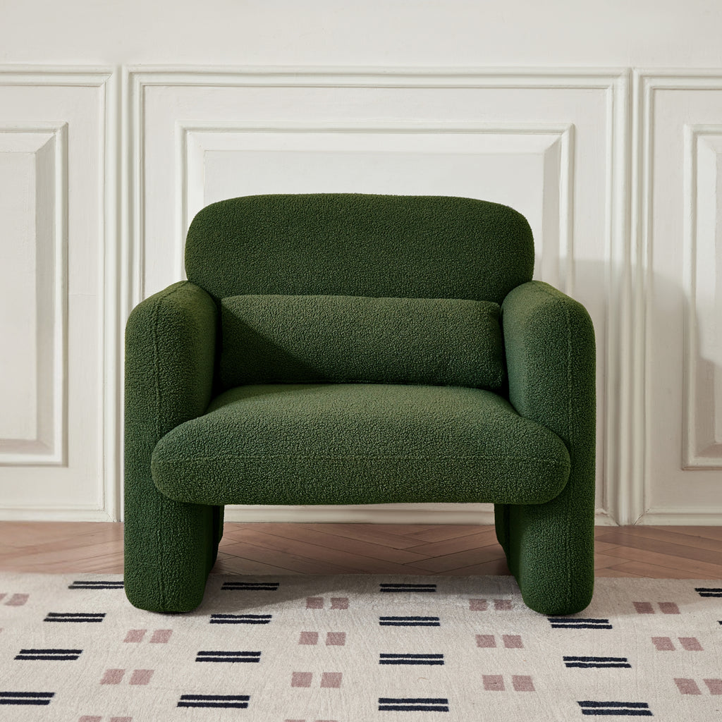 An astrid forest green armchair focus on its shape and colour.