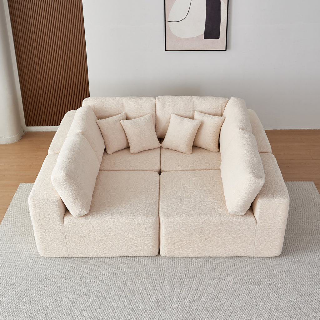 A cream 5-seater modular sofa with a minimalistic design with cushions