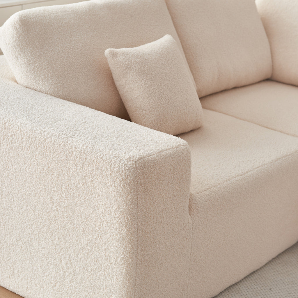 A 5-seater modular sofa cream coloured with a minimalistic design.