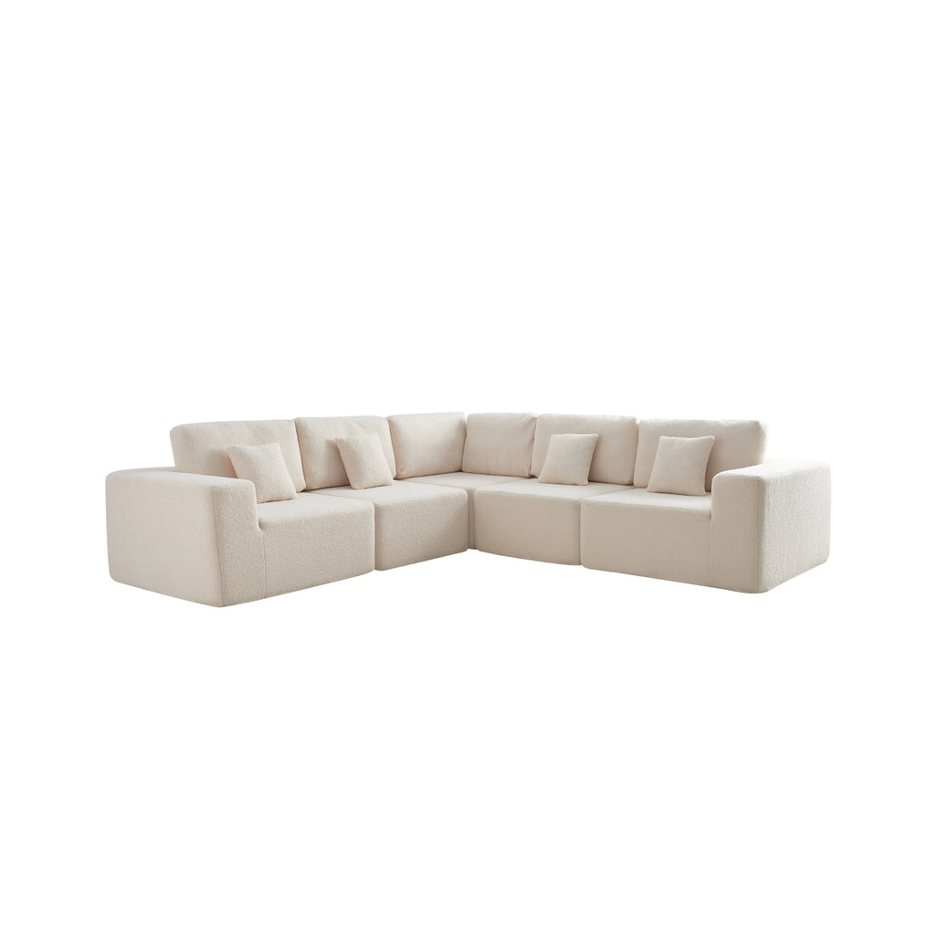 A cream 5-seater modular sofa with a minimalistic design, including a corner unit and two armrest ends.