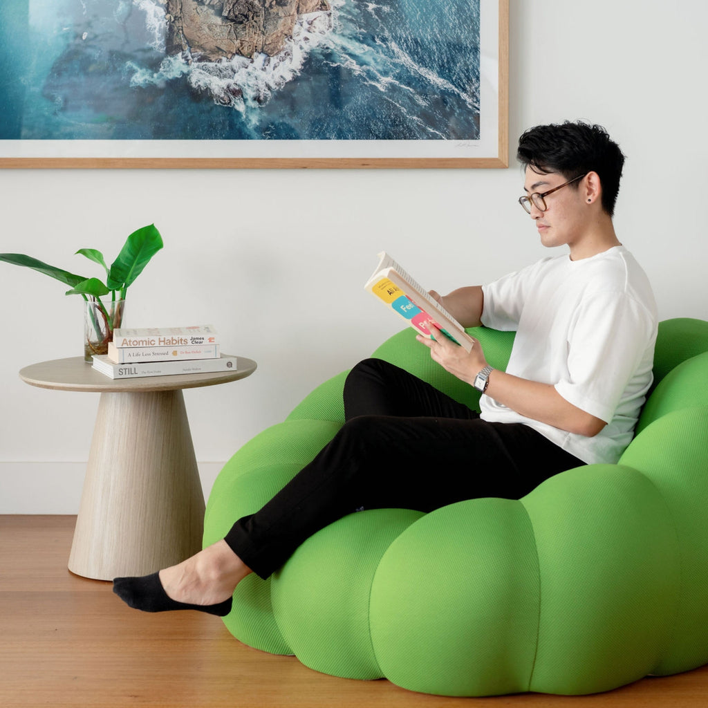 Cosy Cosmo Sofa photos green on a wooden floor 