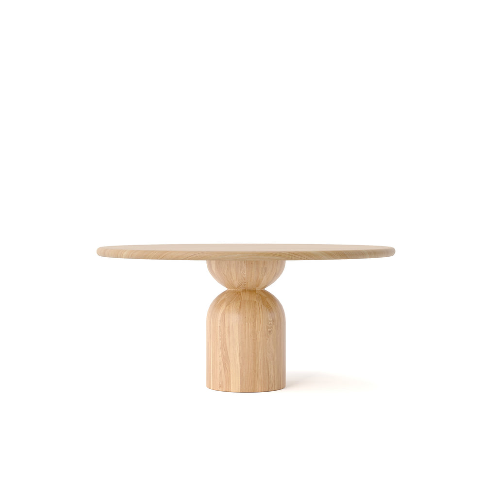 A round wooden dining table on a white background