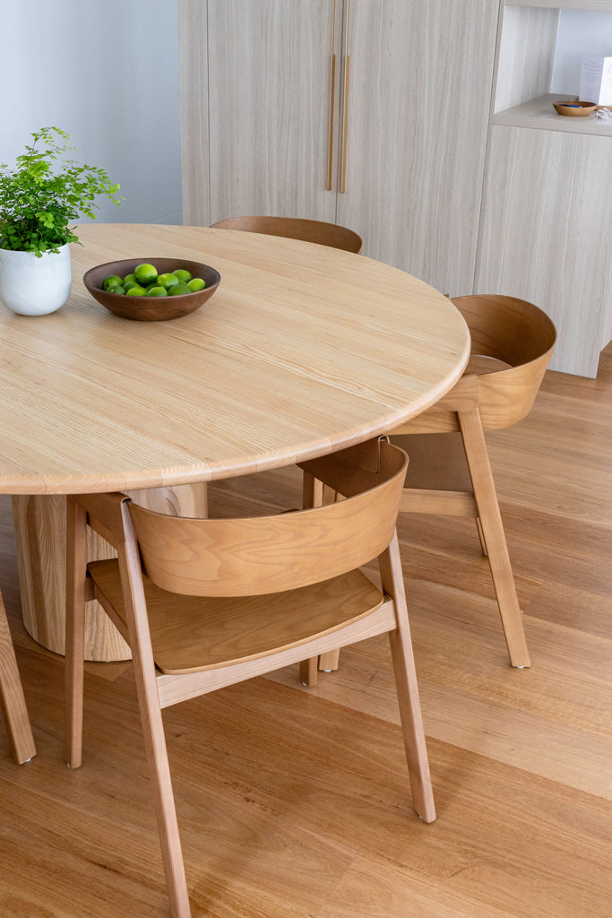 Gather Dining Table in a room with a wooden floor