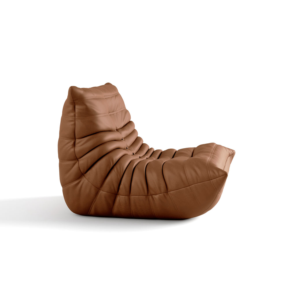 The ochre Junii Fireside sofa stands out with its mid-century modern charm in a white backgound.