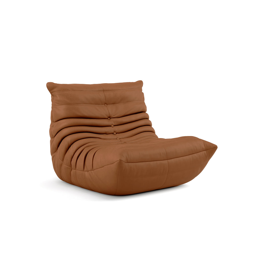 An ochre-coloured Junii Fireside sofa with a unique mid-century modern design, featuring deep seating and a soft matte upholstery.