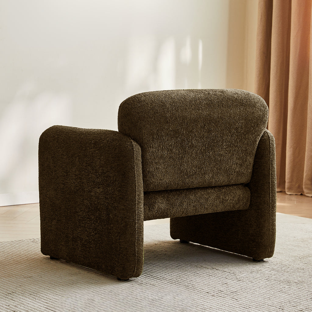 Brown armchair back view in a room with beige curtains and a light-coloured floor.