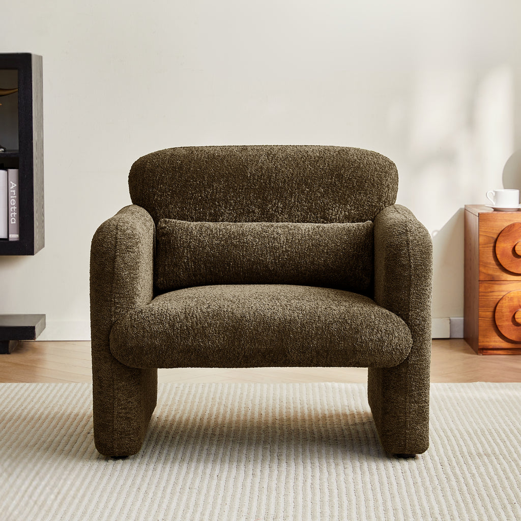 Chocolate brown armchair in a room with a wooden side table and bookshelf.