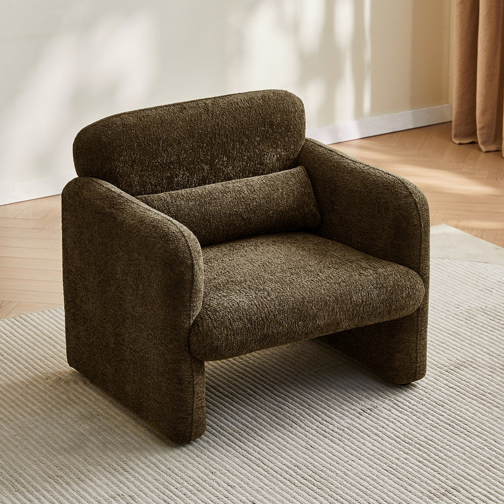 Brown armchair in a room with light-colored walls and wooden floor.