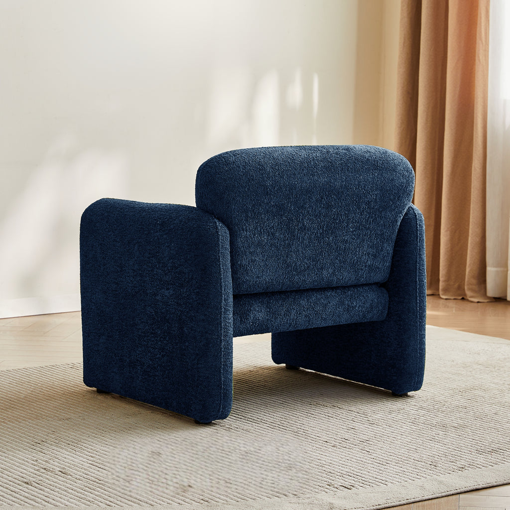 Navy blue armchair back view in a room with a neutral colour scheme