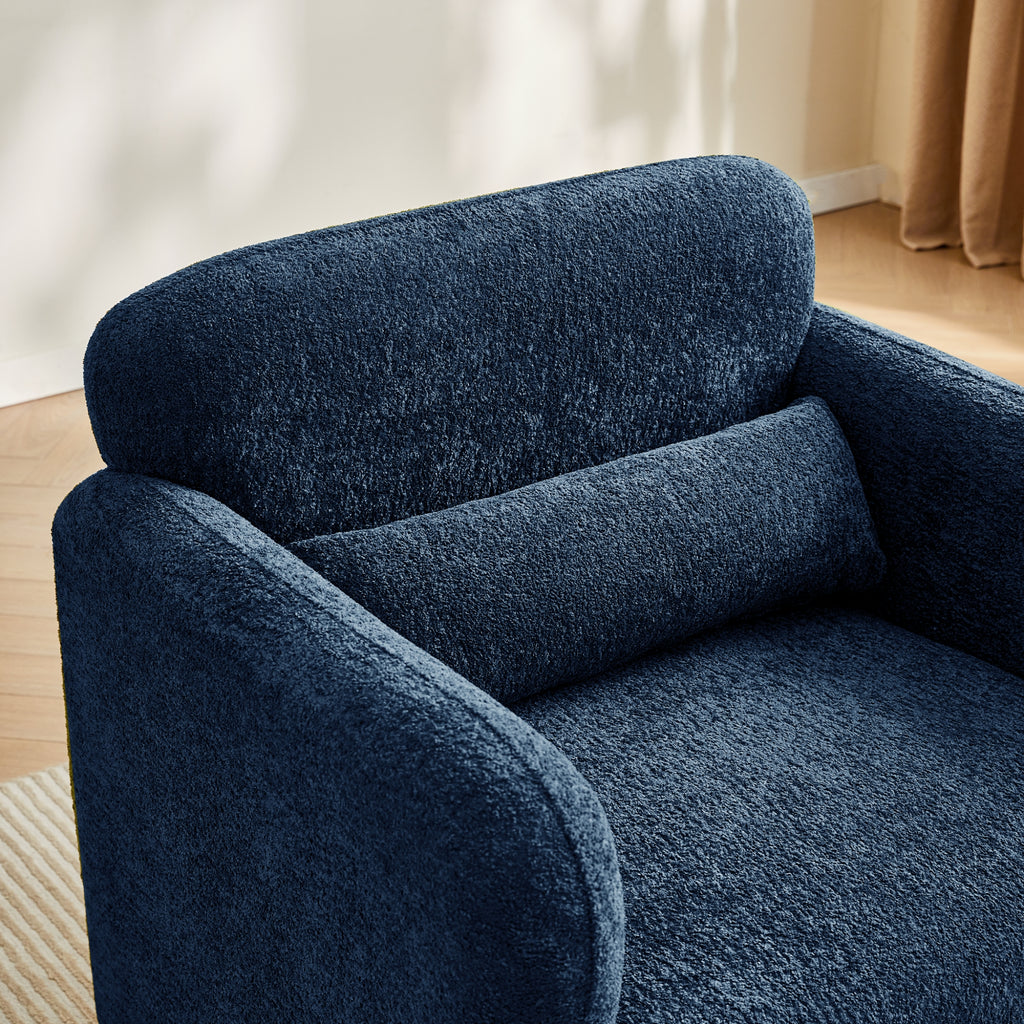 Navy blue textured sofa in a room with light-coloured walls and a wooden floor.