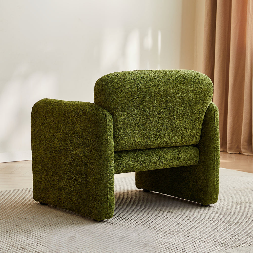 Olive green armchair back in a room with a neutral colour scheme