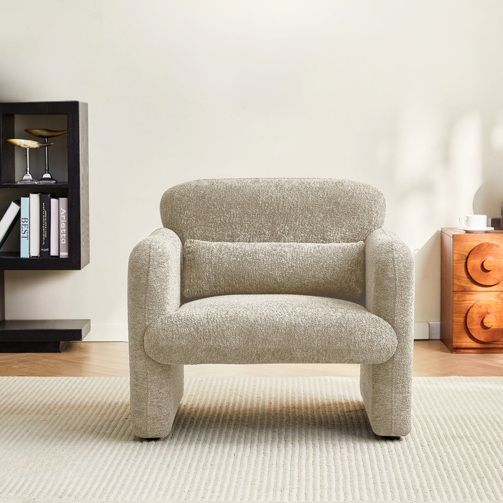Latte armchair in a room with a bookshelf and a wooden side table.