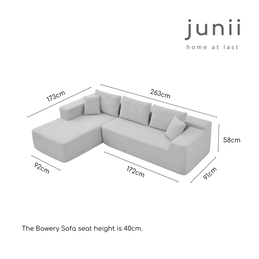 Sectional sofa with dimensions labelled, featuring the brand 'junii'.