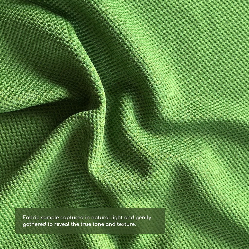 Close-up of photos green fabric with a textured pattern