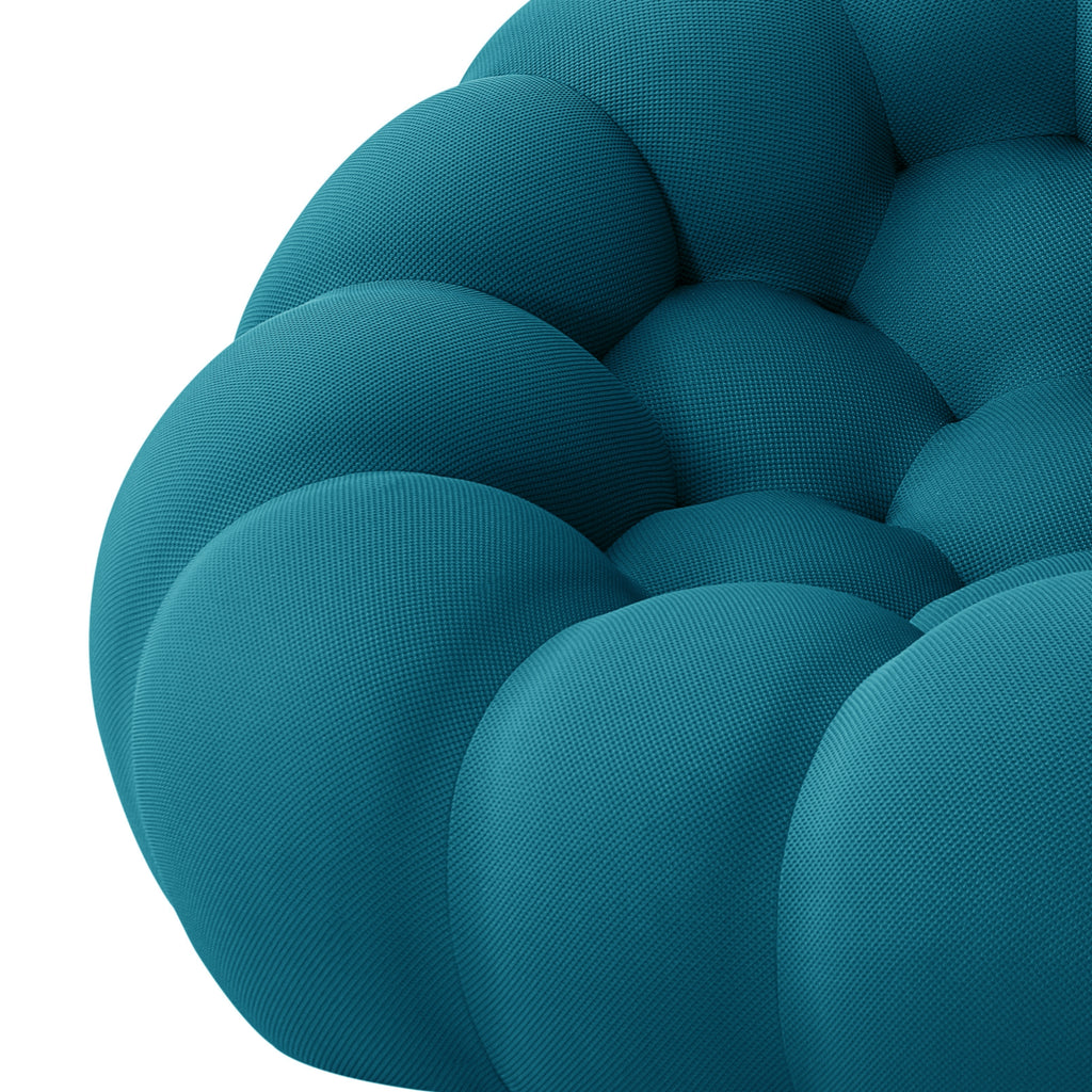 Close-up of a teal bubble sofa with a textured surface on a white background