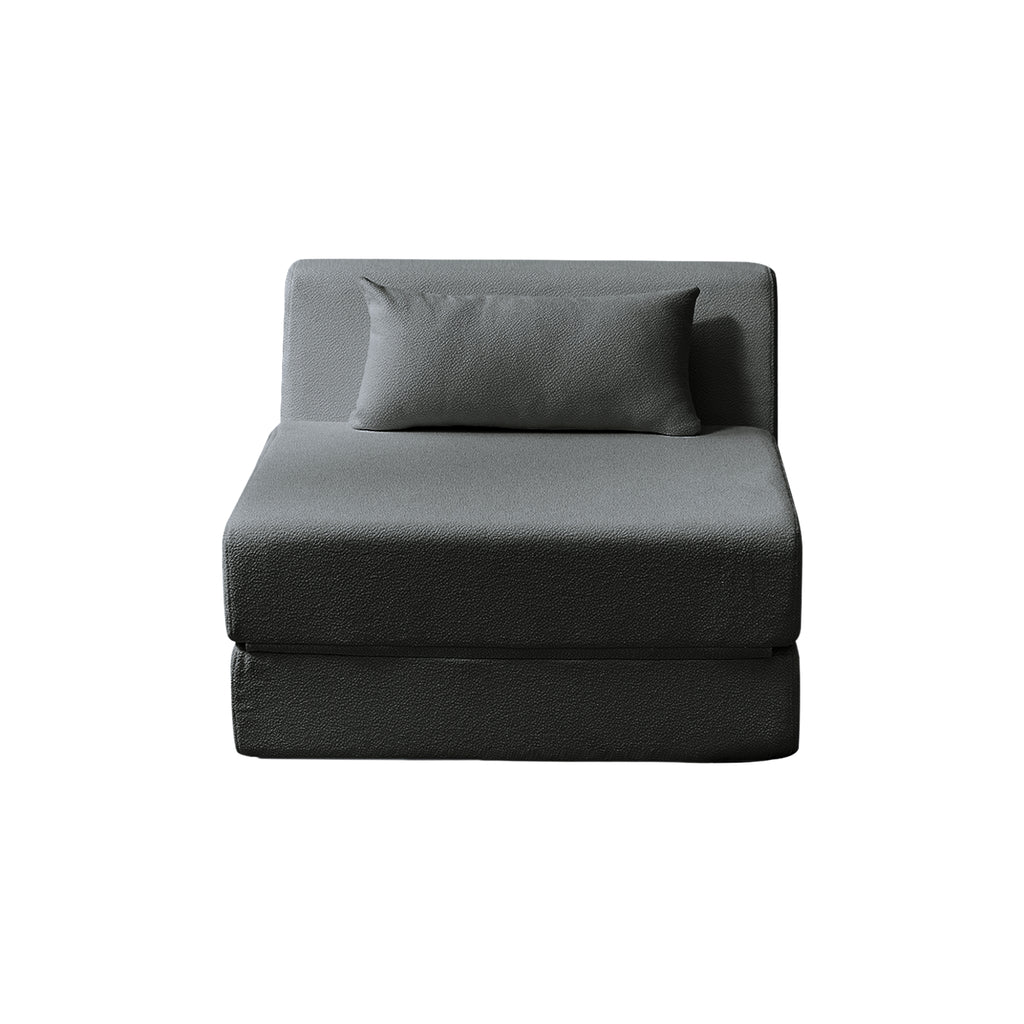 Grey sectional sofa with a pillow on a white background