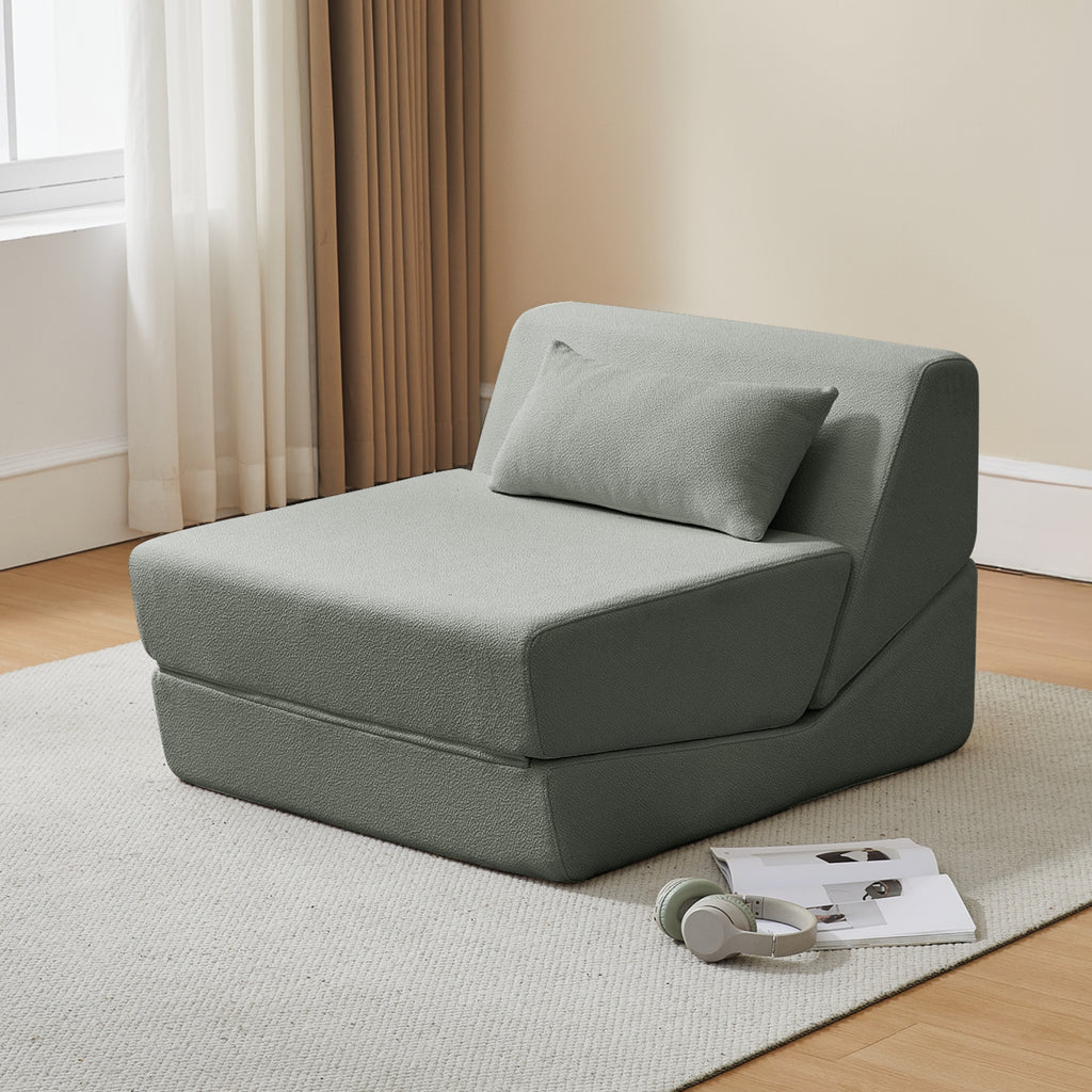 Pebble grey sofa bed in a room with curtains and a rug.