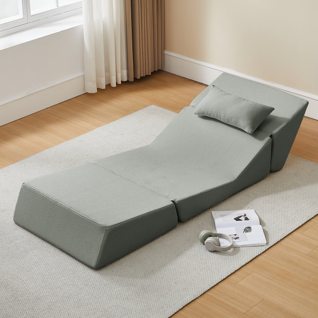 Pebble grey sectional sofa in a room with wooden flooring and a window.