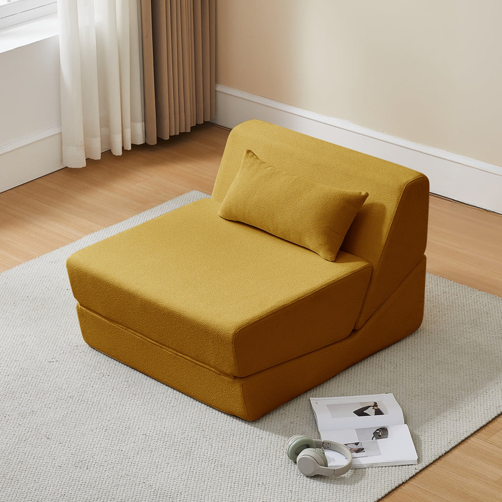 Saffron yellow sofa bed in a room with a rug and curtains