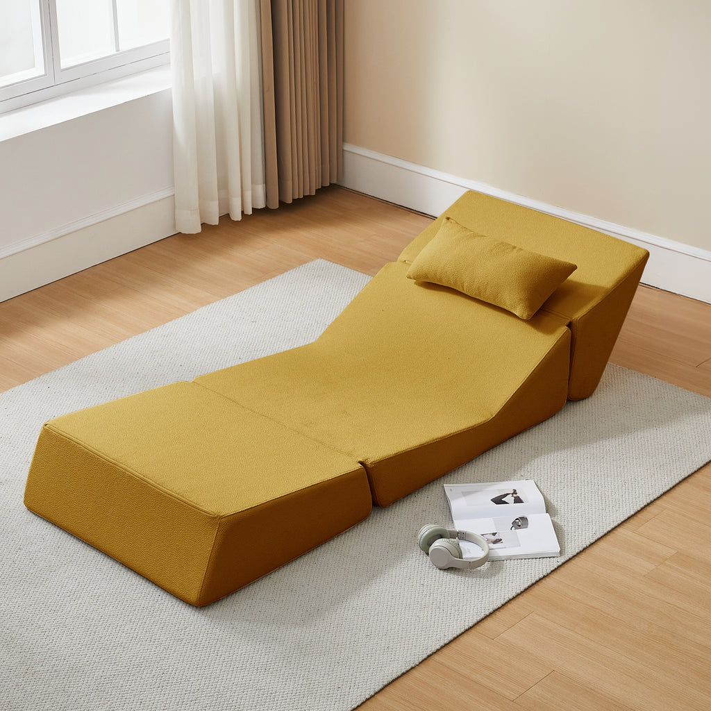 Saffron yellow chaise lounge on a rug in a room with a window and curtains.
