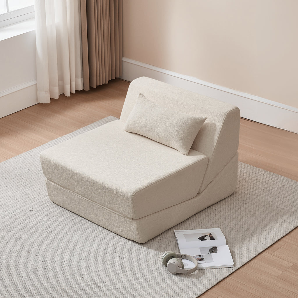 Shell wedge-shaped seat on a light grey rug with a window and curtain in the background.