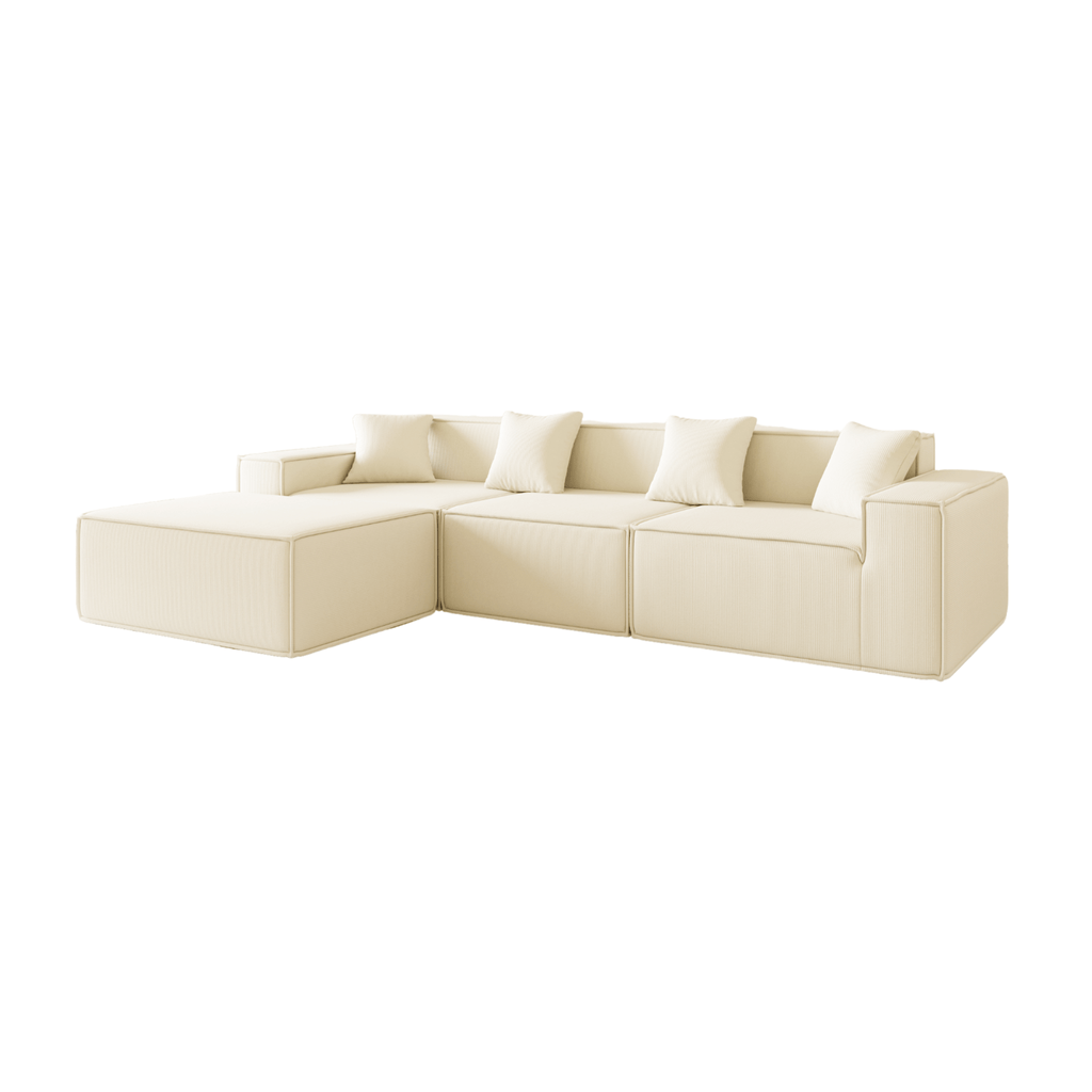 A milk three-seater corduroy sofa with an ottoman, featuring a contemporary design with plush cushions and a geometric shape.